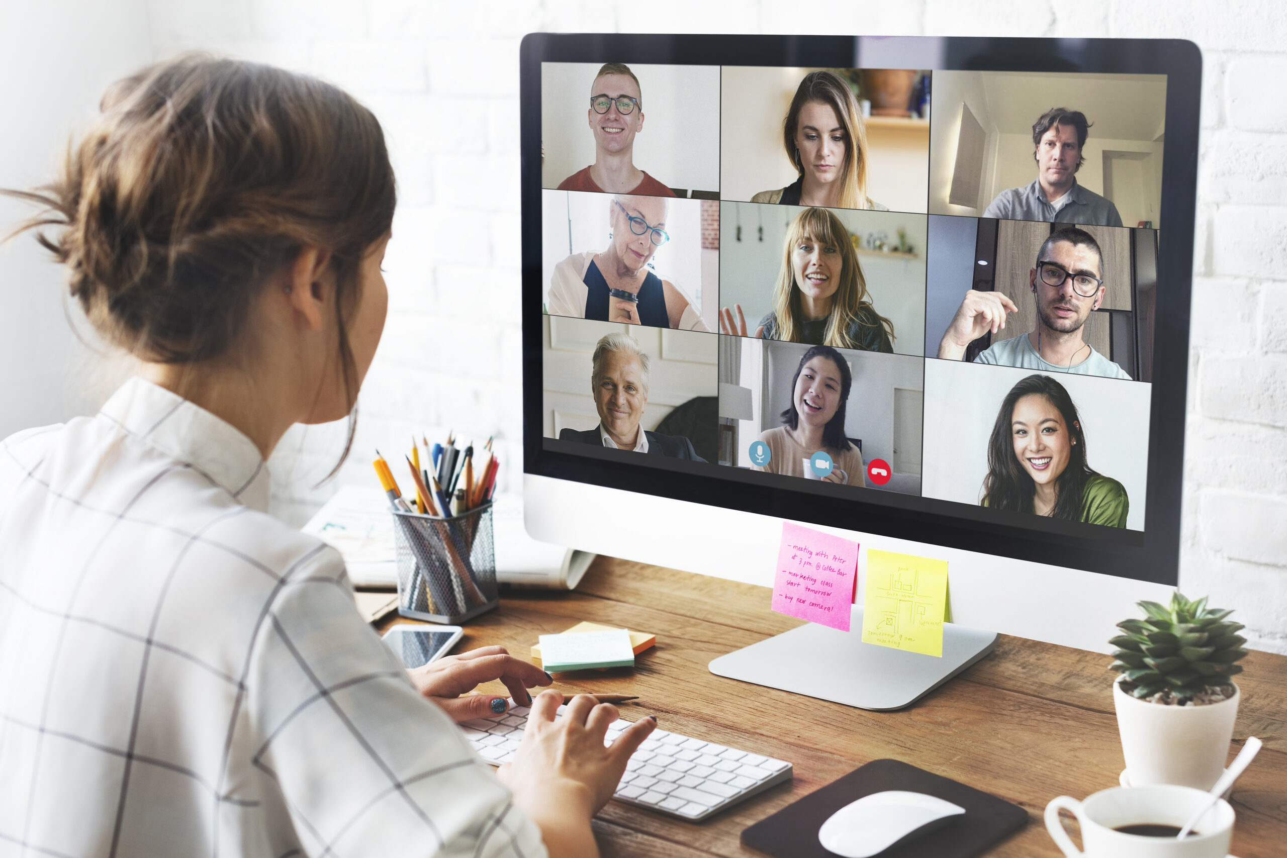 Remote team member joining a video call from a home office desk