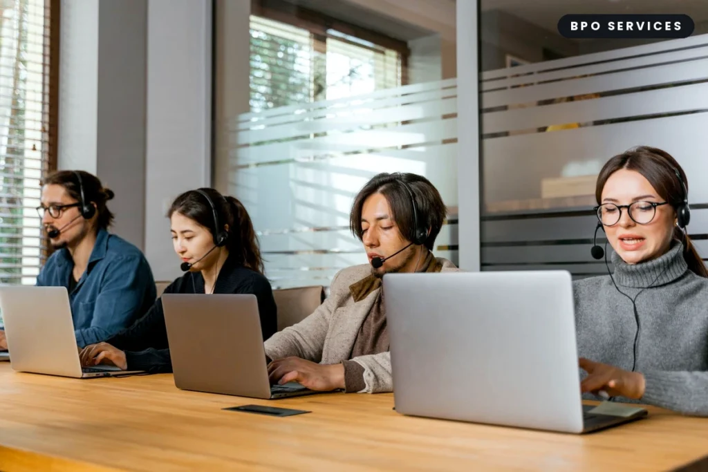 BPO agents working at headset-equipped workstations in a Philippines call center
