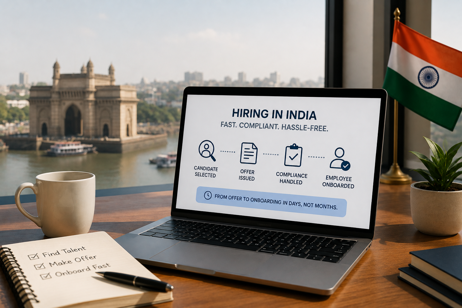 Professional workspace with a laptop symbolizing fast hiring in India through an Employer of Record, overlooking a modern Indian cityscape with business essentials on the desk.