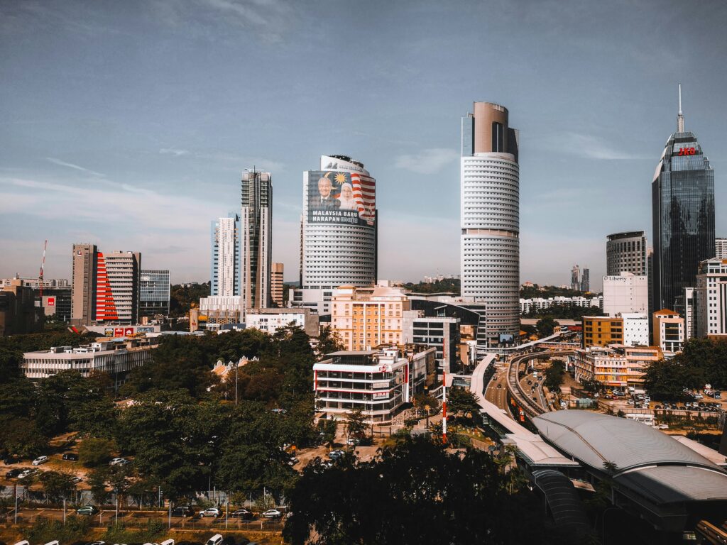 Southeast Asia business district skyline representing cross-market EOR cost comparison
