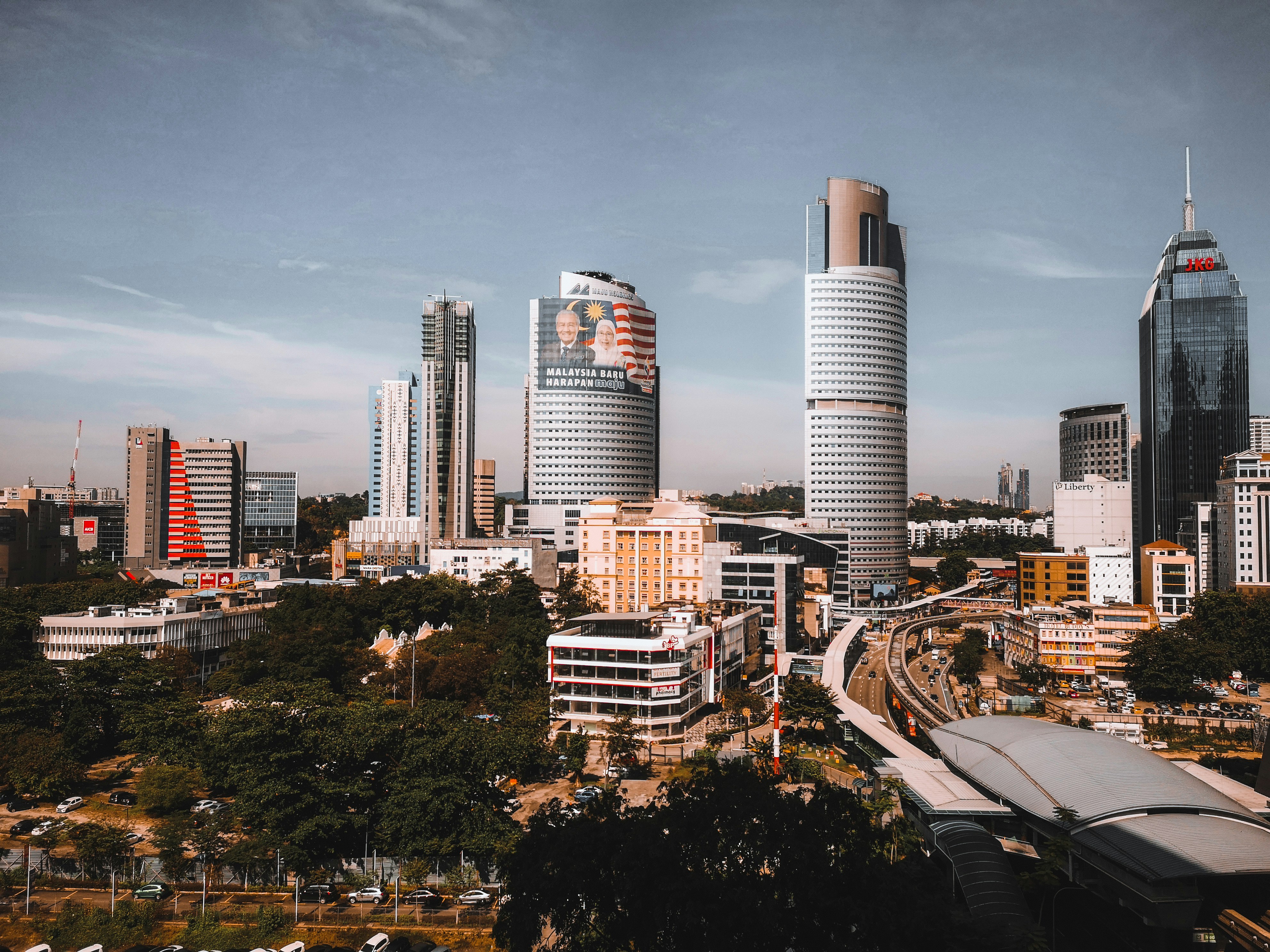 Southeast Asia office skyline representing cross-market EOR cost comparison