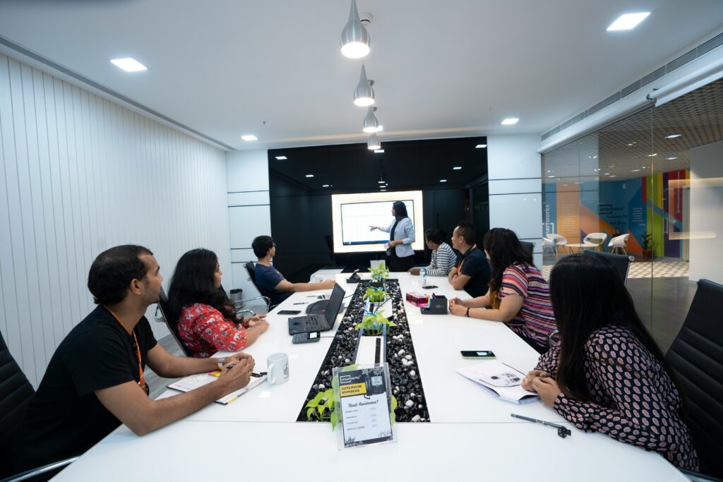 India business professionals in a compliance meeting reviewing the new labour codes